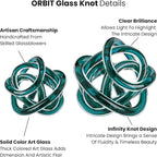 Torre & Tagus Orbit Hand Blown Glass Infinity Knot Sculpture - 3 Inch Glass Art Teal Knot Decor Ball for Home Decor, Small Centerpiece Table Decoration for Home Interior (Clear Teal)