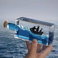 Unsinkable Black Pearl Pirate Ship in a Bottle - Ghost Ship in Ocean Wave Desk Decor for Home Office Decors, Unique Birthday Gifts for Men & Pirate Lovers, Liquid Motion Art Desktop Ornament (Black-e)