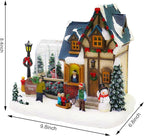 MOMENTS IN TIME Christmas Village Building Lighted Christmas Shop with LED Lights, Music & Snowman Battery Operated or Plug-in Vintage Holiday Village House Décor 8.5”H x 9.8”W x 6.9”D
