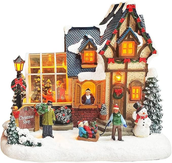 MOMENTS IN TIME Christmas Village Building Lighted Christmas Shop with LED Lights, Music & Snowman Battery Operated or Plug-in Vintage Holiday Village House Décor 8.5”H x 9.8”W x 6.9”D