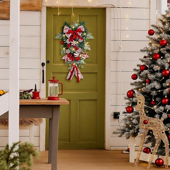 Yunlly 28" Pre Lit Christmas Teardrop Swag Battery Operated Christmas Swag with Lights, Red and White Bowknot, Swirl Candy Cane Ball, Xmas Wreath Ornament for Indoor Outdoor Front Door Decoration