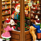 MOMENTS IN TIME Lighted Santa’s Christmas Village Shop LED Lights, Music & Animation Battery Operated 8.8” Holiday Building Christmas Decoration