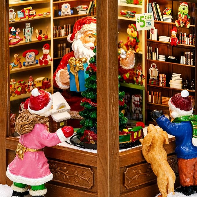 MOMENTS IN TIME Lighted Santa’s Christmas Village Shop LED Lights, Music & Animation Battery Operated 8.8” Holiday Building Christmas Decoration