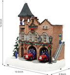 MOMENTS IN TIME Lighted Fire Station Christmas Village 12” Animated Building with LED Lights, 8 Classic Songs & Moving Fire Trucks Power Adapter Included Gift Ready Décor Holiday Display Piece
