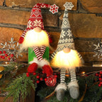 Juegoal 2 Pack Lighted Christmas Gnomes with Dangling Legs, 19.5Inch Handmade Scandinavian Swedish Tomte, Battery Operated Winter Tabletop Christmas Decorations Collectible Figurines